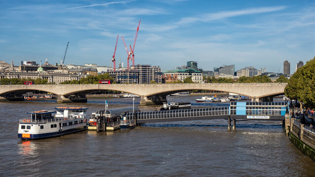 LONDON, UK - SEPTEMBER 29, 2018:  View along the River Thames toward  Festival Pier and Waterloo Bridge
