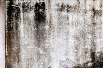 Grungy weathered concrete wall texture with stains and discoloration