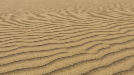 Smooth, golden sand radiating in the bright summer sunlight