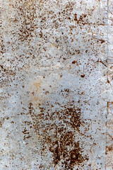 Rusty metal surface texture with brown spots and weathered appearance