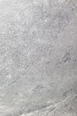 Close-up of gray stone texture with natural patterns and fine details