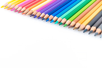 Colourful wooden colored pencils isolated on white background with copy space