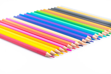 Colourful wooden colored pencils isolated on white background with copy space