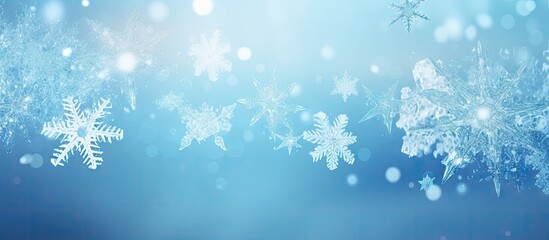 Snowflakes in white delicately overlay a serene blue background with subtle bokeh effects, creating a tranquil winter ambiance.