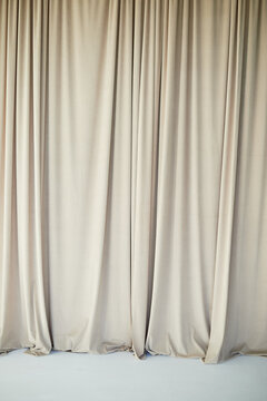 Beautiful curtain or curtain drapery. Natural soft light. Sandy, nude, cream color