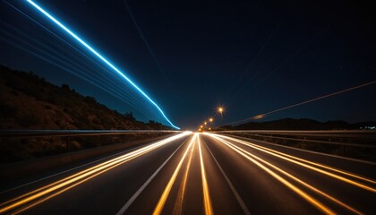 Obraz premium Trails of light from cars on the road at night, created through long exposure