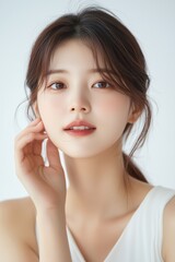 Beauty concept portrait of young Asian woman with soft highlights