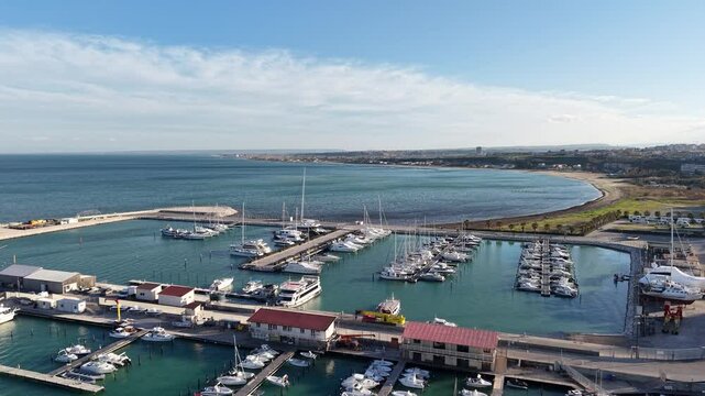 4k drone flight moving over the marina footage (Ultra High Definition, 60fps) of Termoli, Italy. Spectacular Termoli marina and picturesque Italian seascape on Adriatic sea.