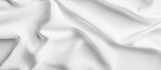 Obraz premium White textured fabric background with soft folds and creases ideal for displaying artwork or design concepts in various artistic projects.