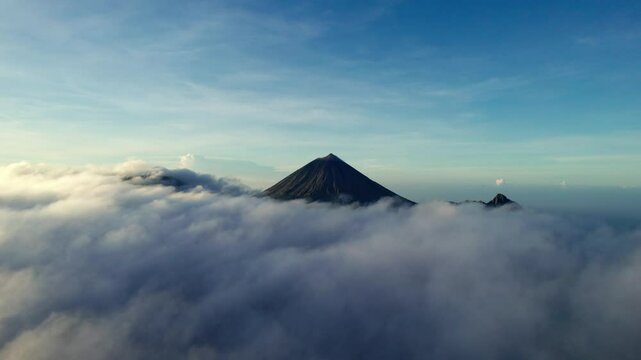 A breathtaking view of mountains with clouds blanketing the valleys below, creating a stunning sea of clouds. Perfect for nature, travel, and landscape content.