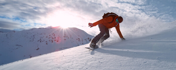 Freeze Motion of Running Snowboarder in Fresh Powder Snow. Austria Alps, Europe.