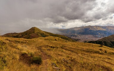 Mountain landscape with cloudy sky over Cusco, Peru.