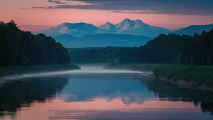 Obraz premium Serene dawn landscape with soft pink and blue hues reflecting on still river water, surrounded by green trees and distant snowy mountains.