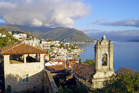 Landscape from Herceg Novi: view of the Church of St. Leopold Mandic, the tower of the fortification system, houses of the Savina district, mountains and the Adriatic sea (Bay of Kotor, Montenegro)
