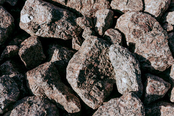 Natural stone texture with cracks, vegetation and dirt, texture background