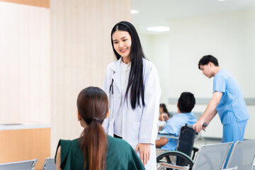 Obraz premium Professional healthcare doctor in white coat engages with patient in counseling session, holding tablet to provide medical advice, provider smile warmly while consulting with patient in private clinic