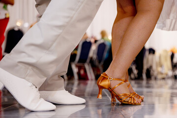 Details of the legs and shoes of a young caucasian couple dancing, Legs of ballerinas dancing at...