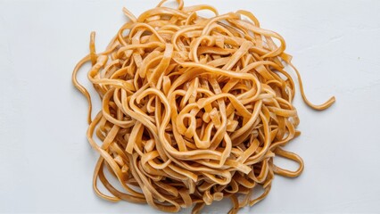 Raw flat rice noodles in a tangled heap with a light beige color against a clean white background, showcasing texture and shape.