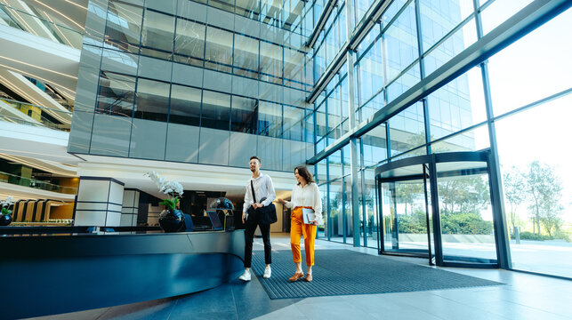 Modern office lobby with colleagues walking together