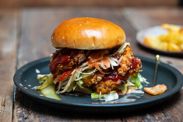 Korean chicken burger with coleslaw and spicy sauce