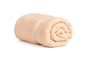 Soft peach towel neatly rolled on a clean surface, showcasing texture and color for home decor or spa use