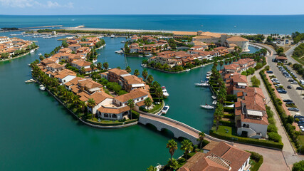 Aerial view of the marina of Policoro, in Basilicata, Italy. A small village with luxurious villas built between the canals.