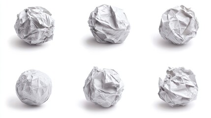 Fototapeta premium Six crumpled paper balls displayed on a white background.