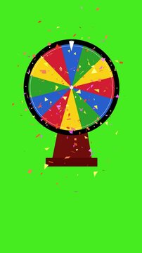 wheel of fortune with confetti explotion isolated green screen. 4k vertical spinning prize game