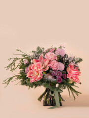 Festive Winter Bouquet with Pink Amaryllis, Carnations, and Christmas Ornaments