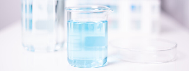 Laboratory beaker blue liquid chemistry chemical research science medical equipment
