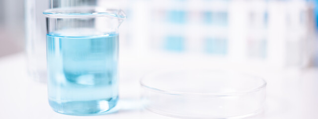 Laboratory beaker blue liquid chemistry chemical research science medical equipment
