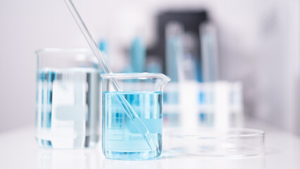 Laboratory beaker blue liquid chemistry chemical research science medical equipment