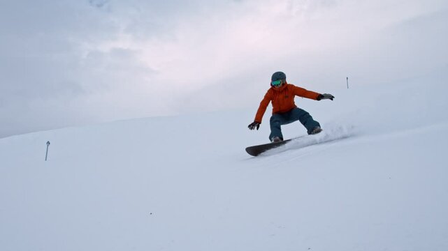 Snowboarder Running Down a Ski Slope. Super Slow Motion, 1000 fps. Skiing on Piste Slope in European Alps Mountains, Austria.