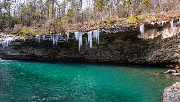 Lula Lake Land Trust, Lookout Mountain, Georgia. Icicles hang from the cliffs surrounding the beautiful aqua-blue water of Lula Lake, which is fed by Rock Creek.