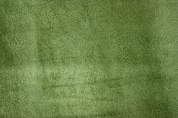 Natural green suede leather as a background macro photo. Suede texture