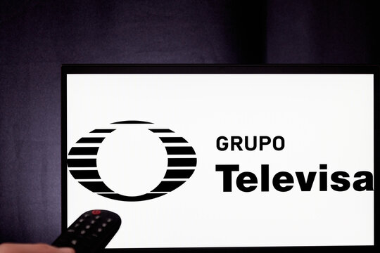 Grupo Televisa logo, projected on a TV set in a dark room. Televisa, leader in audiovisual content. Mexican channel, entertainment icon in Latin America