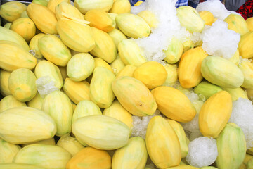 A pile of peeled mangoes for sale, street food, ready-to-eat fruits are widely available on the roadsides of Thailand.