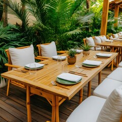 Fototapeta premium Beautiful outdoor dining setup surrounded by lush greenery, featuring natural wood furniture and elegant table settings.