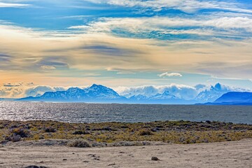 Panoramic view of Lago Viedma near El Chalten in Patagonia against backlight with distant mountains