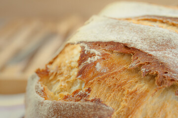 Loaf of bread. Round bread close-up. Freshly baked sourdough bread with a golden crust.