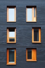 Modern architectural design features wooden windows paired with a sleek dark brick facade in an urban environment, showcasing contemporary building aesthetics during daylight hours