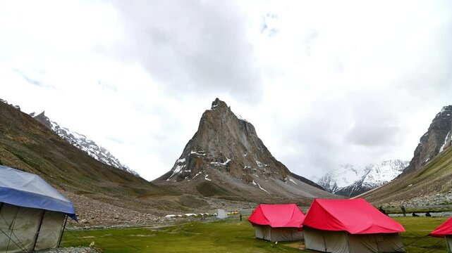 Timelapse of cloud moving on Gonbo Rangjon which is a stand-alone lofty rocky precipice located south of Kargyak village in the Lungnak valley, Zanskar, Ladakh, India	