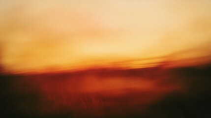 Obraz premium Abstract sunset background in blurred orange and red tones, creating a soft transition