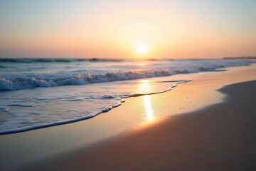 Obraz premium A beach at dawn, with soft light illuminating the water and sand.