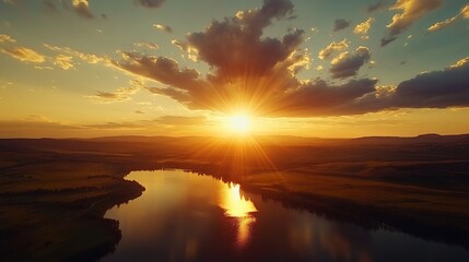 Fototapeta premium Golden Hour Reflection, A serene sunset over a landscape with water, capturing the warm colors of the sun.