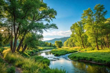 Fototapeta premium Serene river flowing through lush green landscape under a vibrant blue sky.