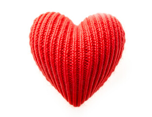 Knitted heart made of red wool threads. light white background.