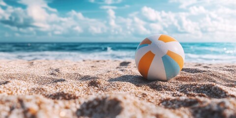 Obraz premium Beach Ball on Sandy Beach