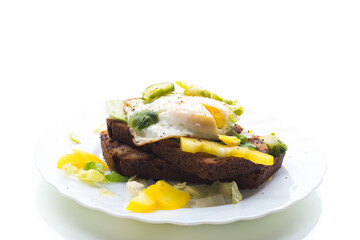 Light breakfast with fried egg, isolated on white background