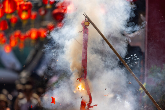 Traditional Chinese firecrackers are exploding with flashes and smoke in Lunar new year.